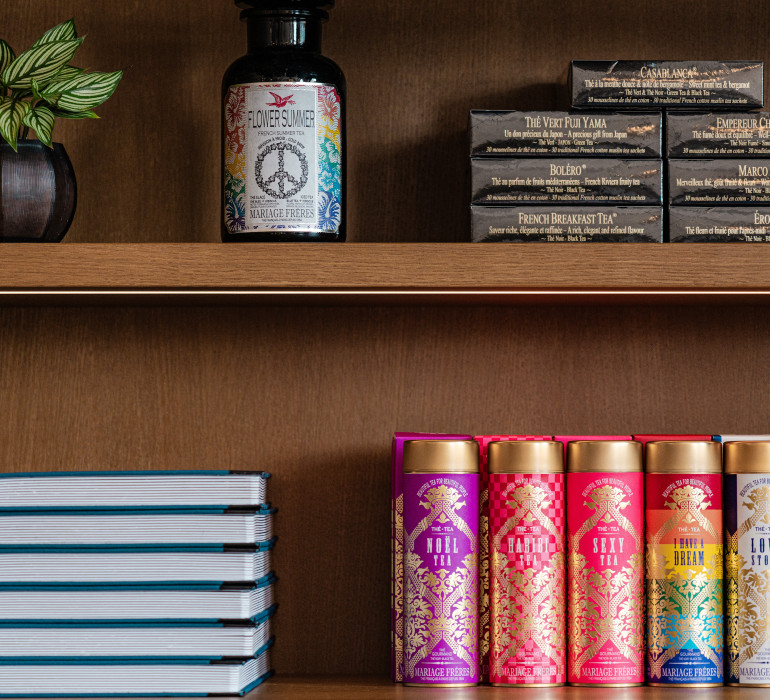 Close-up of a shelf with books and bottles