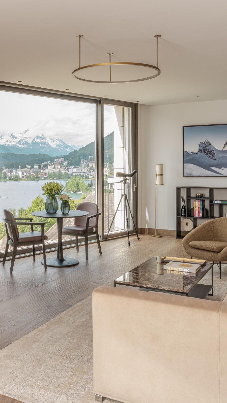 Hotel suite with an elegant living room and a terrace with a direct mountain view