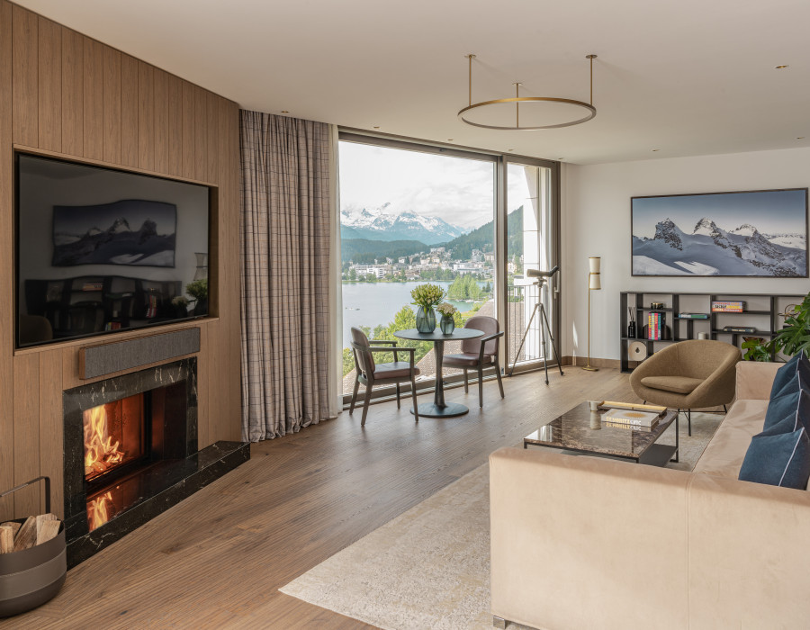 Hotel suite with an elegant living room and a terrace with a direct mountain view