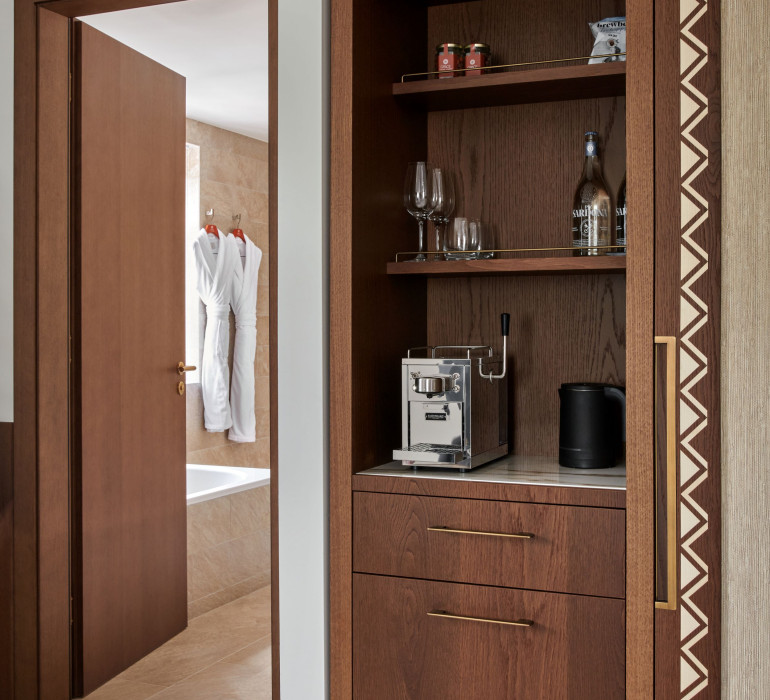 La Margna Junior Suite featuring a large wooden shelf and a door