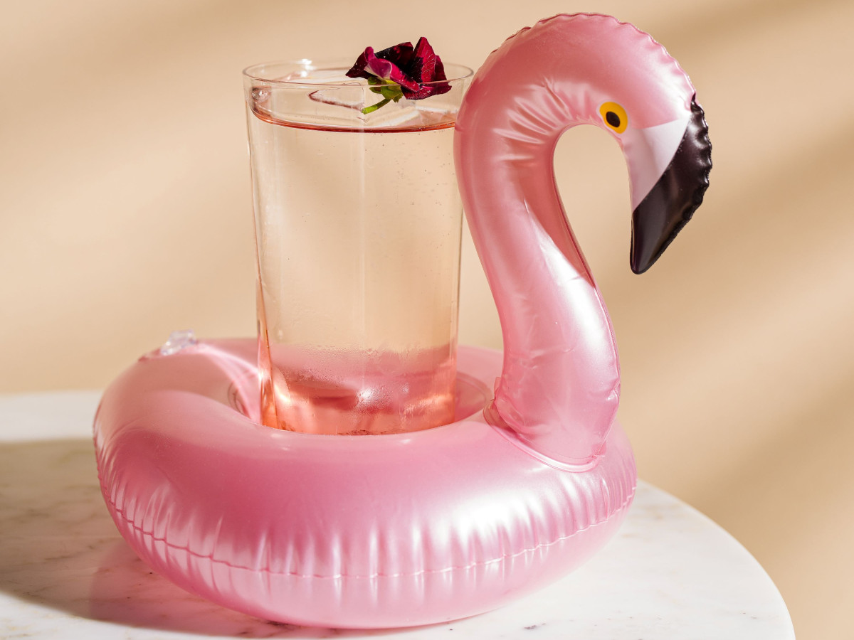 A pink cup holder in flampingo shape on a marble table at the luxury hotel st moritz