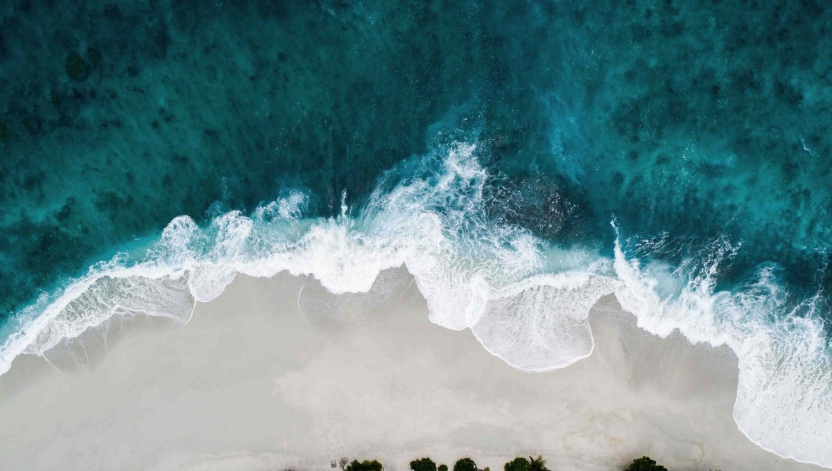 Sky view at a coast with rocks and blue water